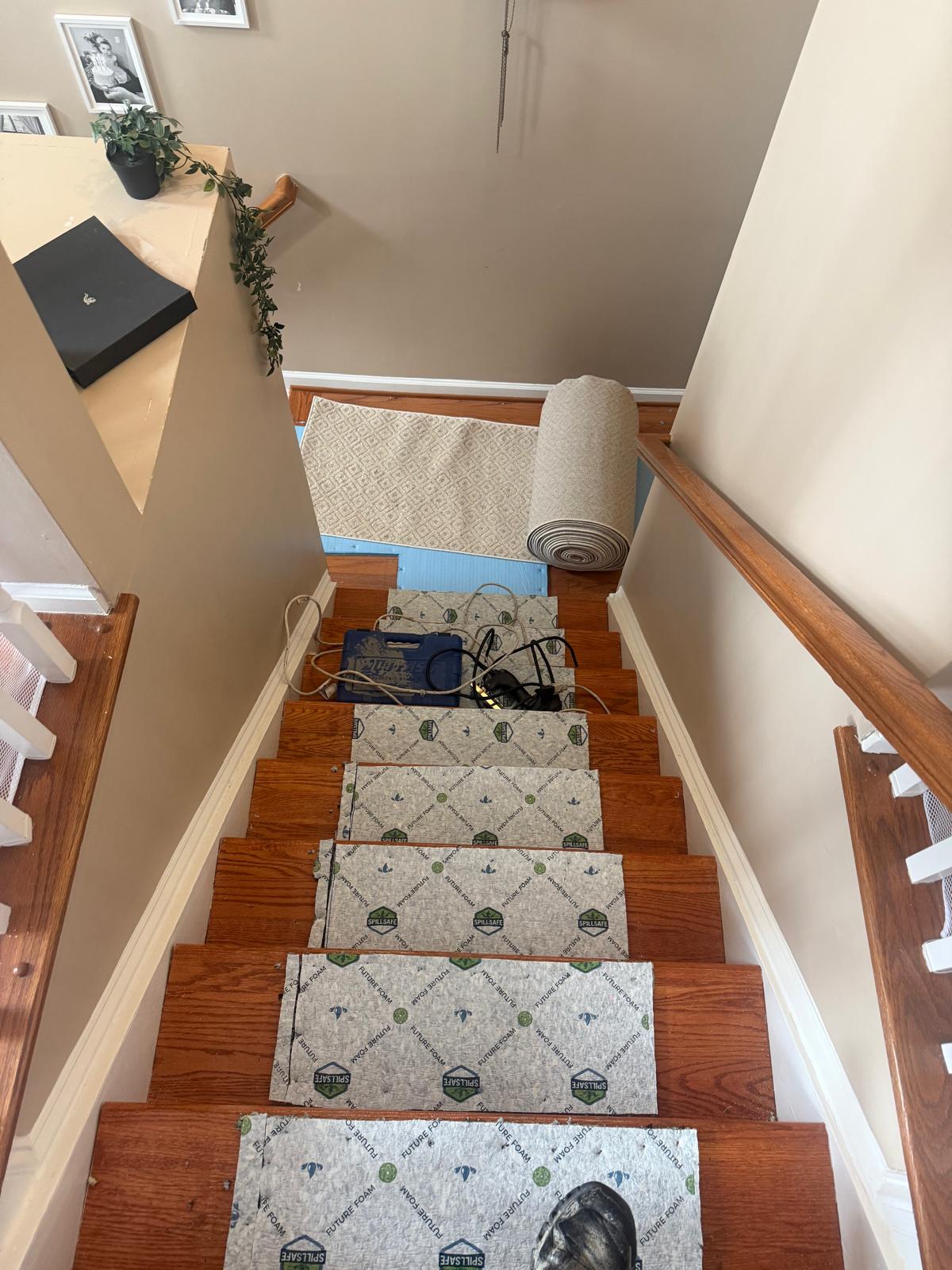 New padding fitted on each stair tread before the runner goes down